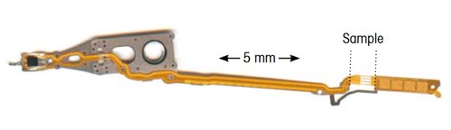 Figure 1. Access arm for moving the read/write head over the surface of a disk in a hard disk storage device. A small sample of about 0.4 mg was cut out from the position shown and analyzed by DSC.