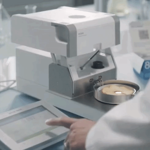 Scientist working in a lab and checking analytics Scientist working in a lab and checking analytics
